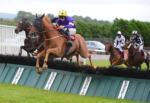Big Generator & Conor Walsh jumping a hurdle on their way to victory