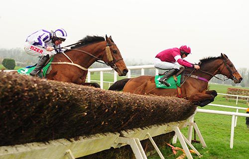 Mozoltov (Davy Russell) leads Irish Thistle (Andrew Lynch) over the last