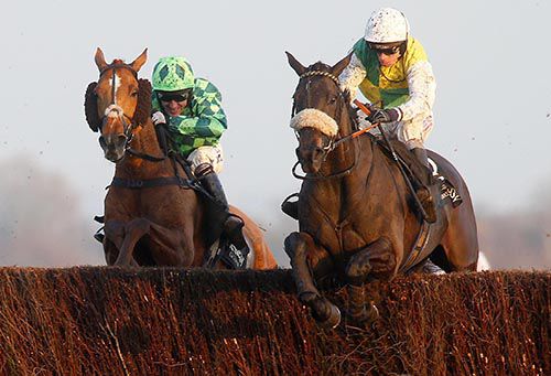 Many Clouds (right) pictured on his way to victory in the Hennessy Gold Cup at Newbury