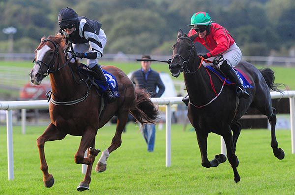 Tornado Watch and Ruth Dudfield (left) lead home Classic Theatre, with winning trainer Emmet Mullins in the background 