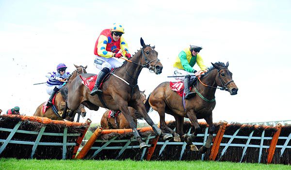 Sassy Yet Classy, left, clears the last in Cork